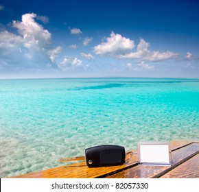 Car Rental Keys On Wood Table With Blank Paper In Vacation Caribbean Tropical Beach [Photo Illustration]