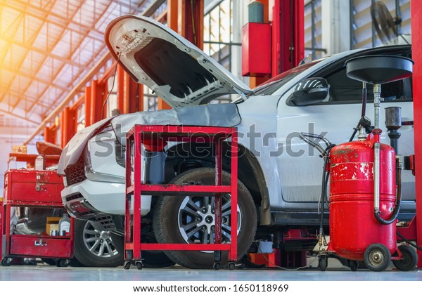 Car repair in garage service station\
repair. Car under repair in a car repair\
station