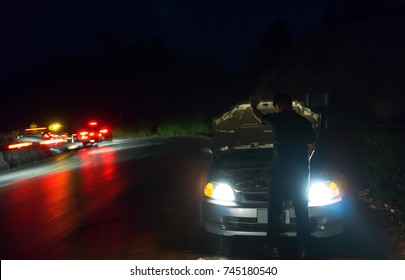 Car Repair At Night,Business Man Repairing Car At Night On Building Background,Broken Car.