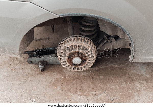 Car repair, rusty rear wheel drum brake. Top\
view, close-up.