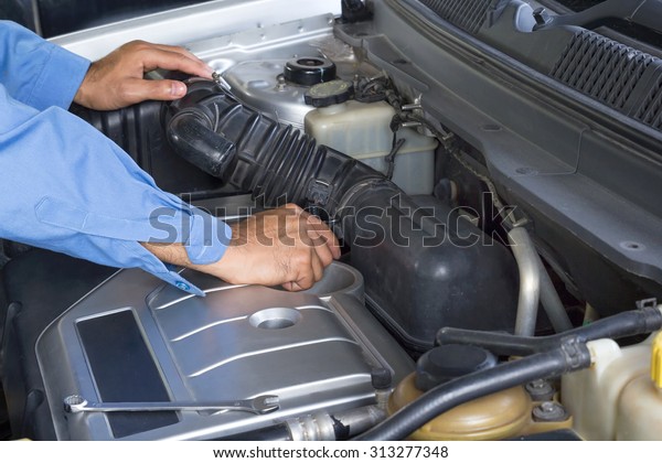 Car\
repair service, Auto mechanic repairing car\
engine