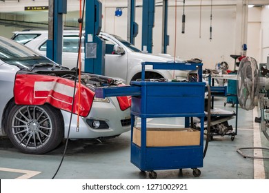 Car Repair Service Center With Fixing Tool Trolley