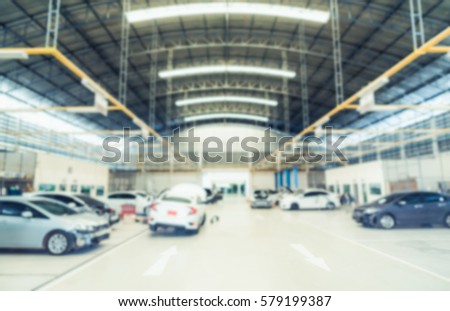 Car repair service centre in blurred background