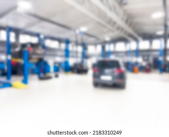 Car Repair Service Station Garage Blur Background. Car Service Centre With Cars At Repair Station Bokeh Light Defocused Blurred Background