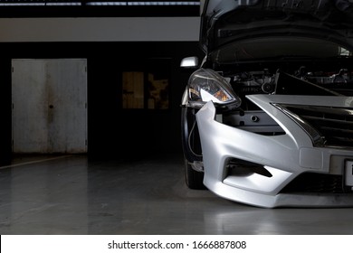 Car In Repair Station And Body Shop With Soft-focus And Over Light In The Background