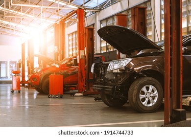 Car In Repair Station And Body Shop With Soft-focus And Over Light In The Background