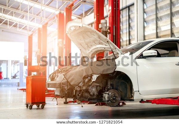 car in repair station and body shop with
soft-focus and over light in the
background