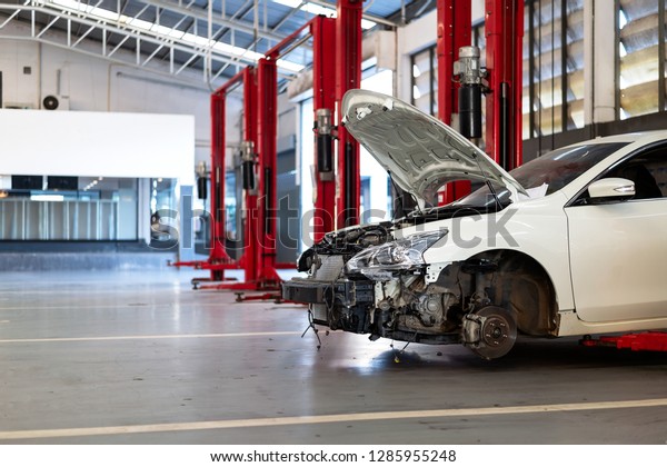 car in repair station and body shop with\
soft-focus and over light in the\
background