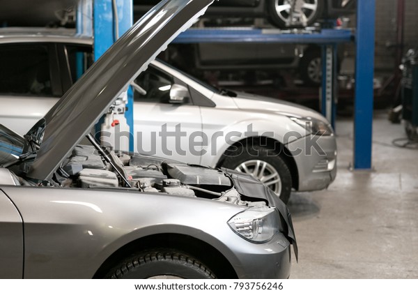 car repair station. cars stand in small service and\
repair one car.