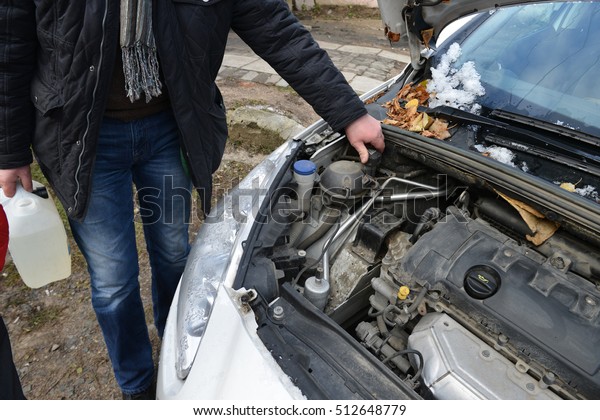 Car repair, topping up\
fluid