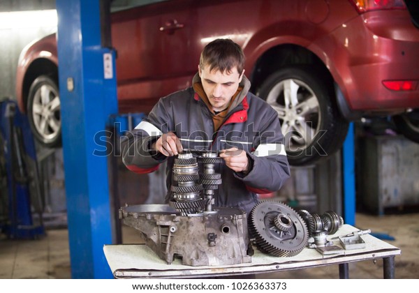 car repair at a car\
workshop