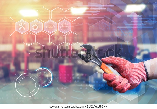 Car repairing mechanic hand of car technician auto\
with a wrench tools and equipment working in automobile garage,\
repair shop station fixing service concept modern futuristic icon\
background overly