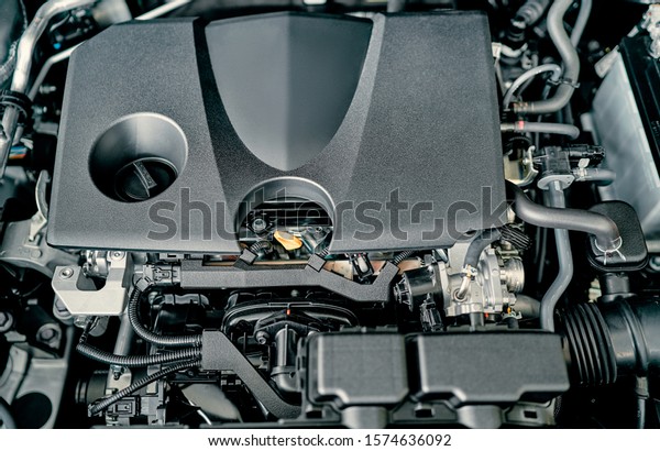 Car Repairing. Modern Compact Car\
with Open Hood. Car Under Maintenance.\
Engine.