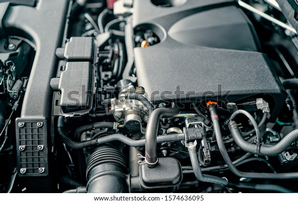 Car Repairing. Modern Compact Car\
with Open Hood. Car Under Maintenance.\
Engine.