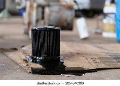 Car Replace The Fuel Filter. Used Oil Purification Filters On The Dirty Surface Of The Barrel With A Shallow Depth Of Field