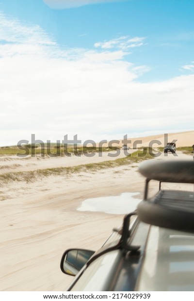 Car ride in the dunes of Jericoacoara\
on vacation. Tourist point of ceará brazil. Tourist destinations\
concept. Vacation travel concept. copy\
space