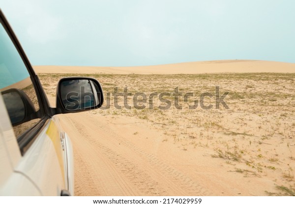 Car ride in the dunes of Jericoacoara\
on vacation. Tourist point of ceará brazil. Tourist destinations\
concept. Vacation travel concept. copy\
space