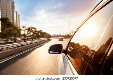 Car ride on road in sunny weather, motion blur 