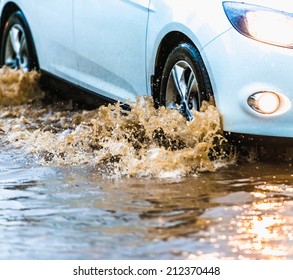 Car Rides On Big Water In The Rain