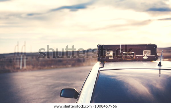 Car in road  with the roof\
box 