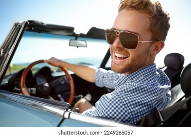 Car road trip, travel and portrait man on holiday adventure, happy transportation journey or fun summer vacation. Flare, sunglasses and driver driving convertible vehicle on Canada countryside tour - Powered by Shutterstock