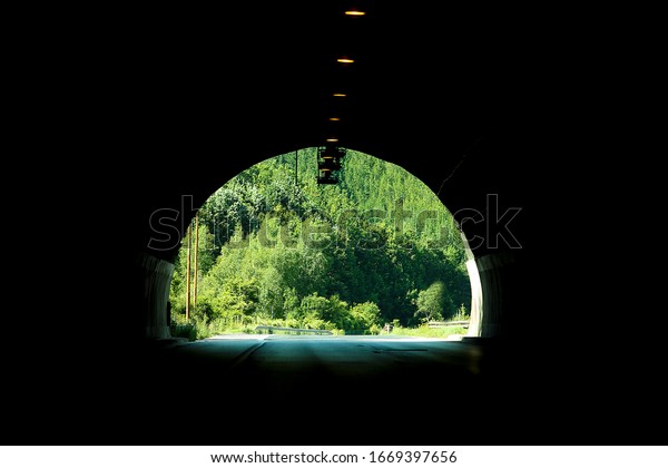 a car road tunnel in\
dark