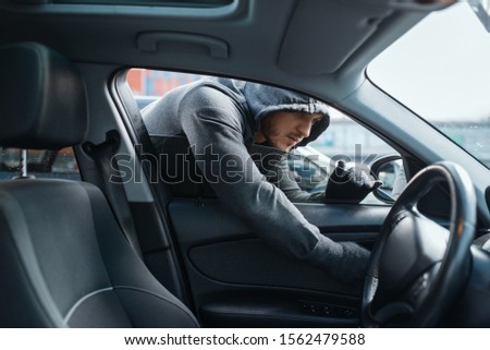 Car robber opening door, risk job, stealing