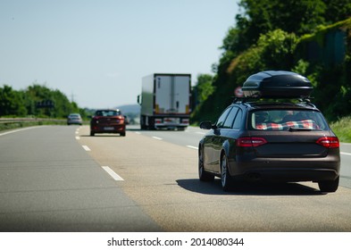 Car With Roof Box On Germany Autobahn 