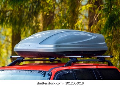 Car with roof luggage box container for travel