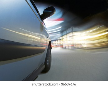 A Car, Running On Empty, Driving Into A Petrol Station At Night To Get Refueled