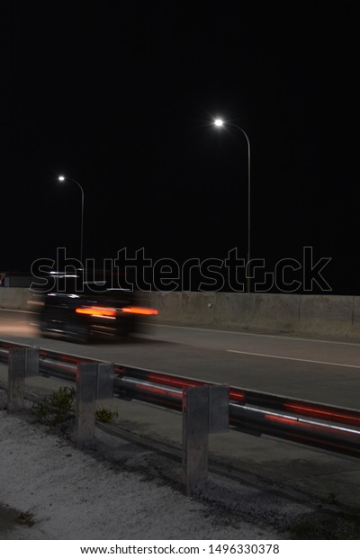 The car runs at\
night with slow speed taken