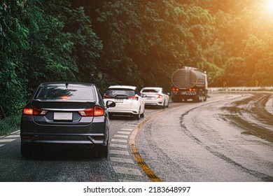 Car In Rural Road In Deep Rain Forest With Green Tree Forest View From Above, Rental Car In Spain Mountain Landscape Road At Sunset, Aerial View Car In The Forest On Asphalt Road Background.