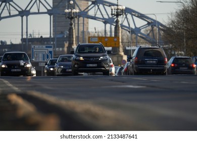 Car rush hours city street. Cars on highway in traffic jam 04-03-2022 Riga, Latvia