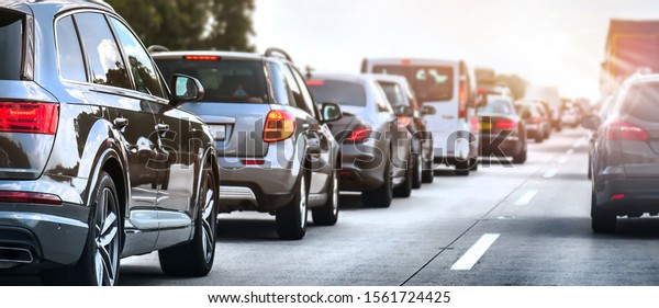 Car rush hours city street. Cars on highway in\
traffic jam
