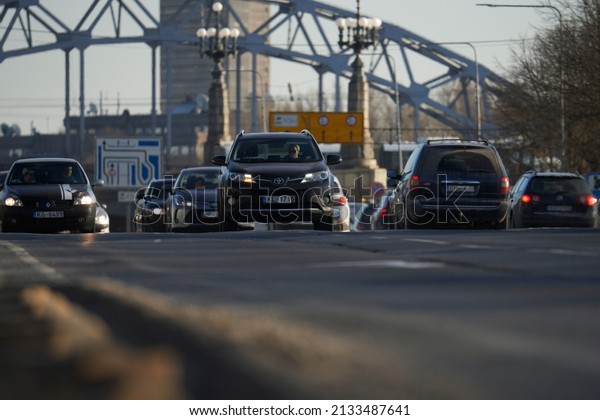 Car rush hours city street. Cars on highway\
in traffic jam 04-03-2022 Riga,\
Latvia