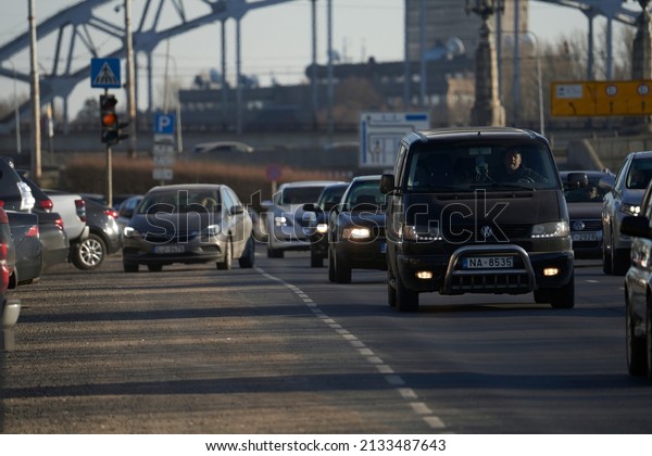 Car rush hours city street. Cars on highway\
in traffic jam 04-03-2022 Riga,\
Latvia