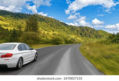 A car rushes along a forest road. - Powered by Shutterstock