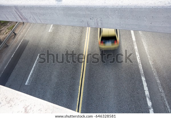 car rushes
along the highway speed camera
view