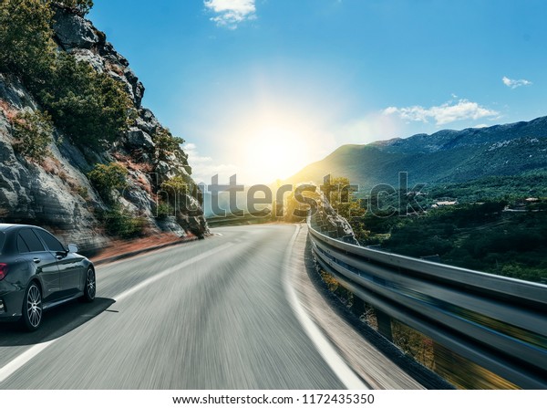Car rushing along a\
high-speed highway.