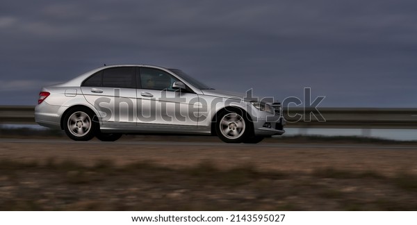 car rushing along a high-speed highway. Toned
photo. 27-03-2022 Riga.,
Latvia