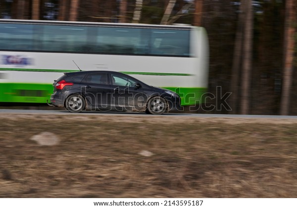 car rushing along a high-speed highway. Toned\
photo. 27-03-2022 Riga.,\
Latvia