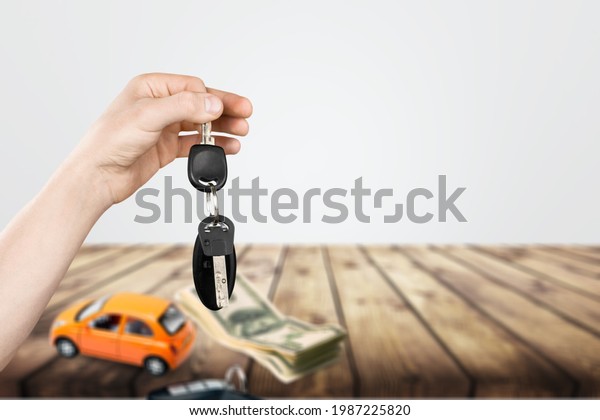 Car salesman gave the keys to the customers,\
Purchase contract and key\
delivery.