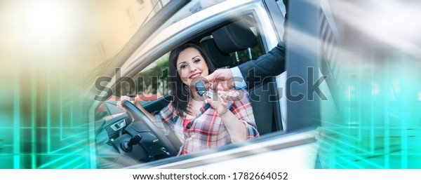 Car salesman giving car keys to pretty young\
woman; multiple exposure