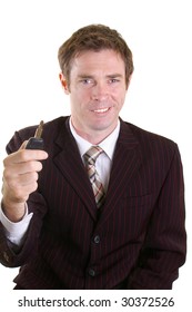 Car Salesman Holding Key Ready For Hand Over