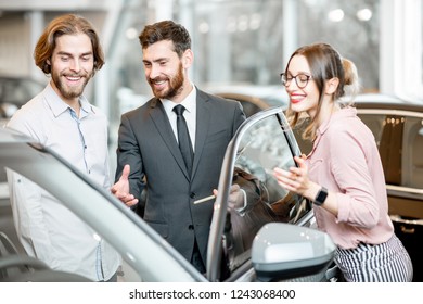 Car Salesman Showing Car Interior Young Stock Photo 1243068400 ...