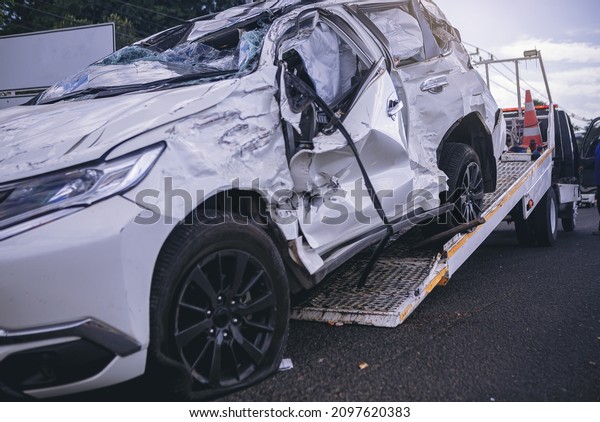 A car scary crashing
damage rescued by slide car service after dangerous accident on the
road.	