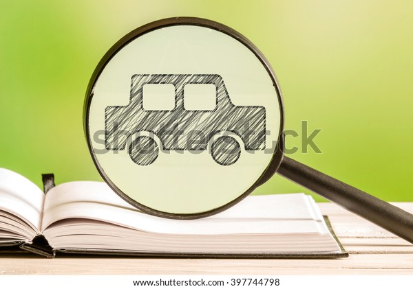 Car search with a pencil drawing of an automobile\
in a magnifying glass