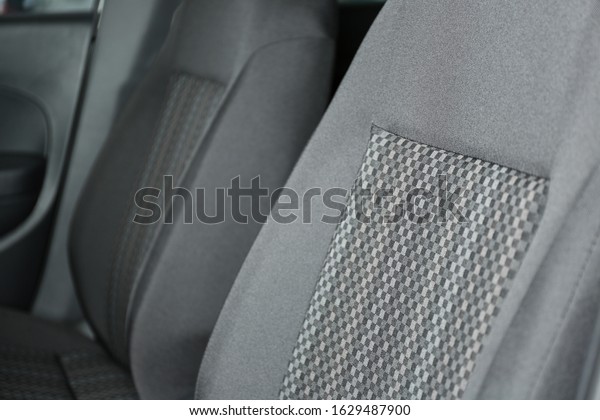 Car seat with\
grey upholstery, closeup\
view