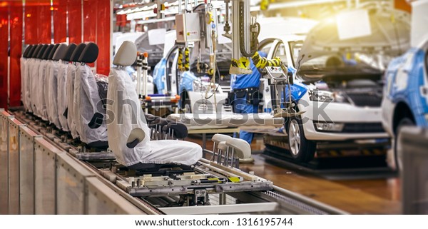 Car\
seat installation line in a car manufacturing\
plant