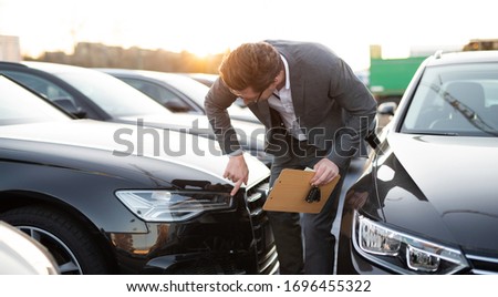 Car seller at work selling cars